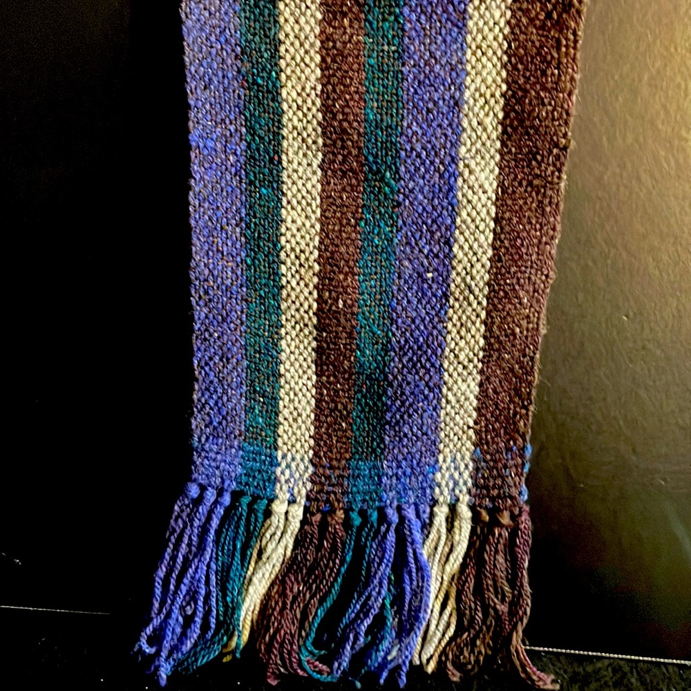 This Handwoven Scarf is 60 inches long and has multiple colors.  Unisex